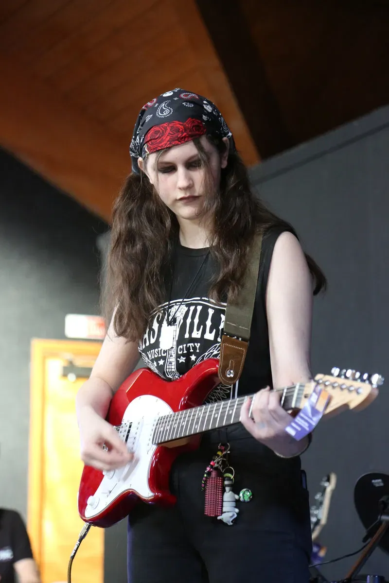 DeRosa pupil playing electric guitar