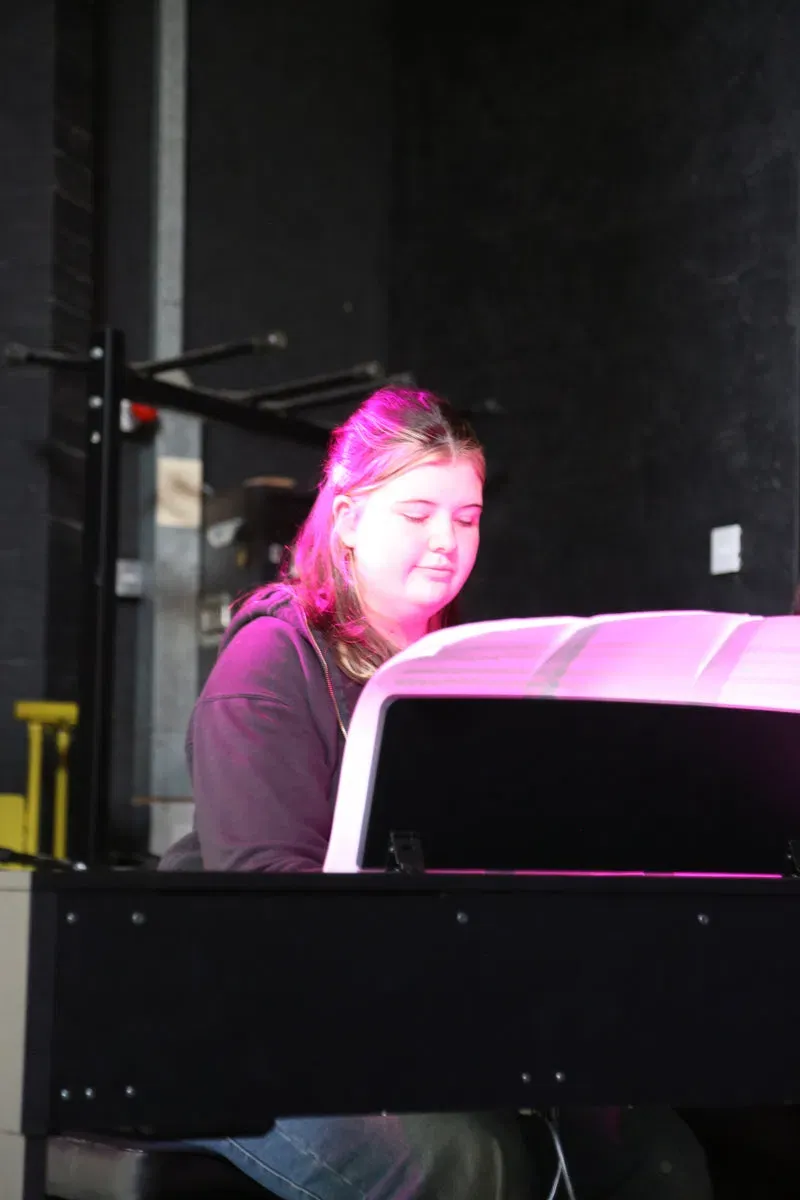DeRosa pupil playing piano during a performance