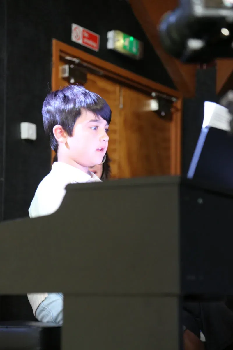 DeRosa Music pupil performing at the piano