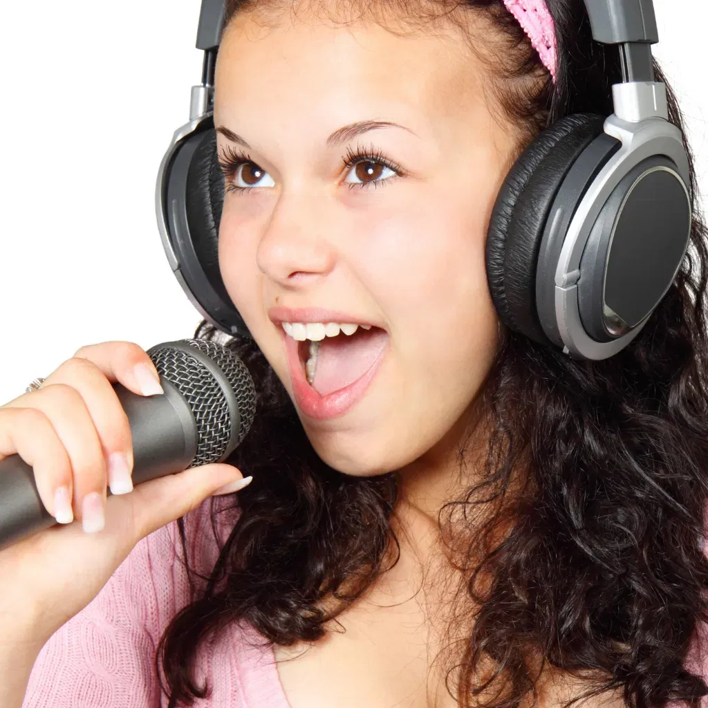 DeRosa pupil singing into a microphone
